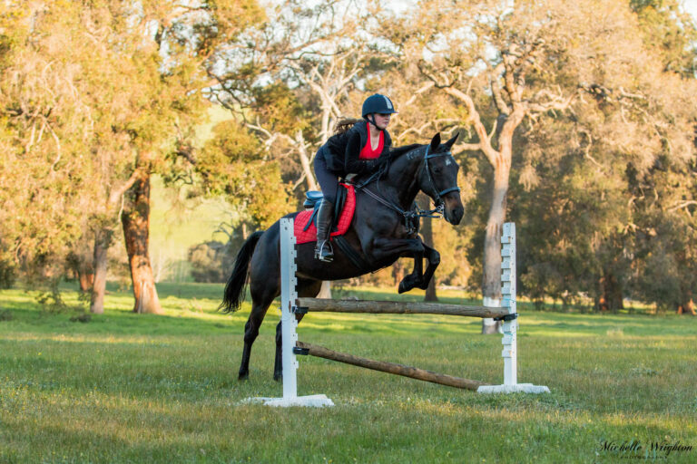 Miss B riding and jumping with Sandy