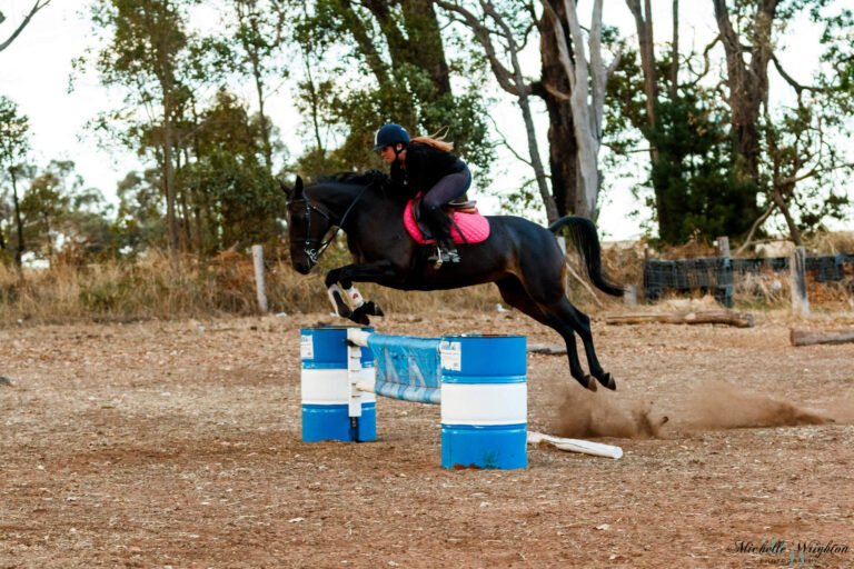 Miss B riding and jumping with Jackson