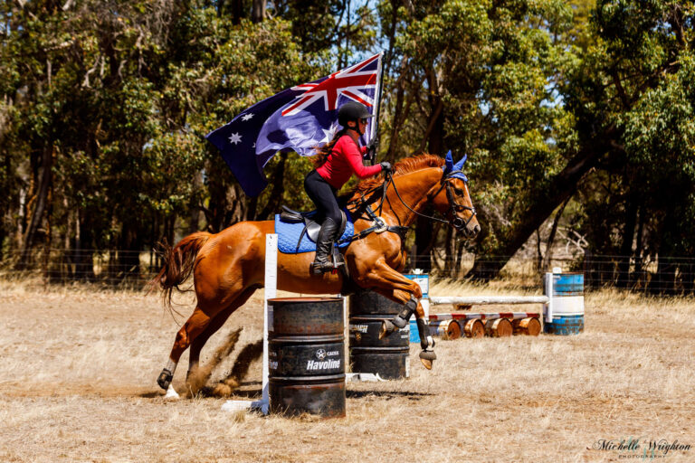 Miss B riding Flame on Australia Day with the Australian Flag