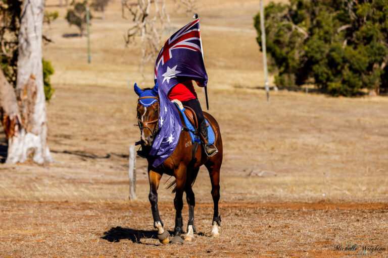 Miss B riding Shiloh on Australia Day with the Australian Flag