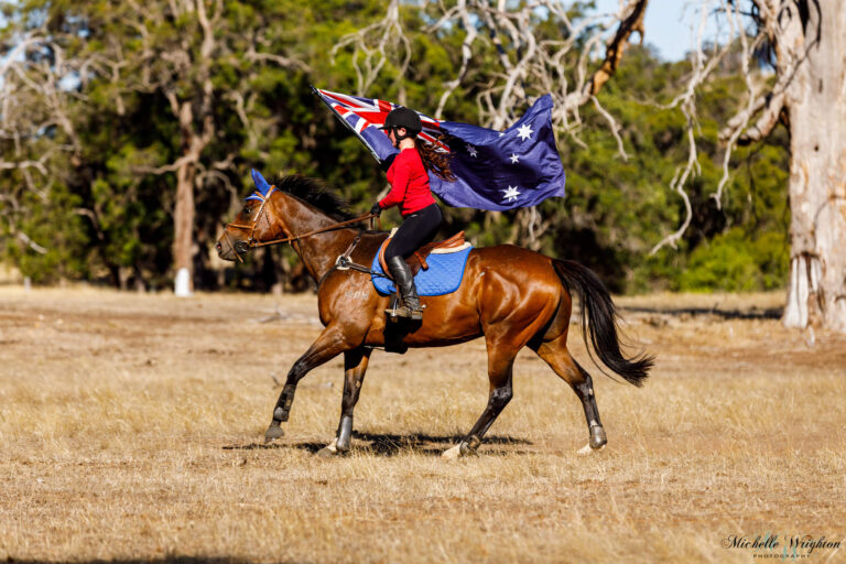 Miss B riding Shiloh on Australia Day with the Australian Flag